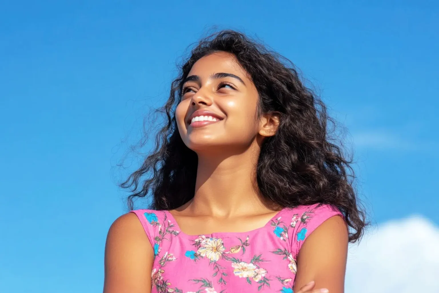 young woman smiling after online therapy India